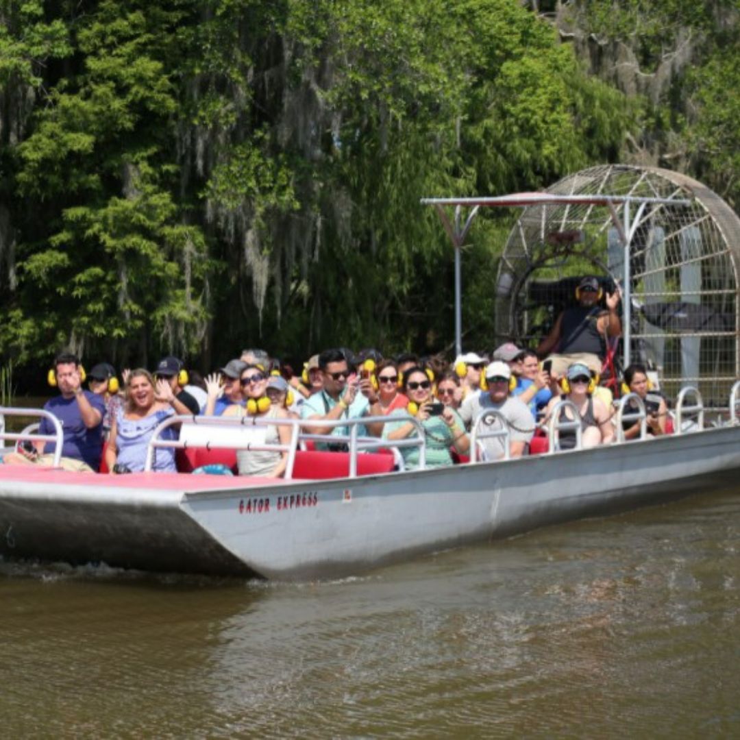 Louisiana swamp tour airboat moving on the water.
