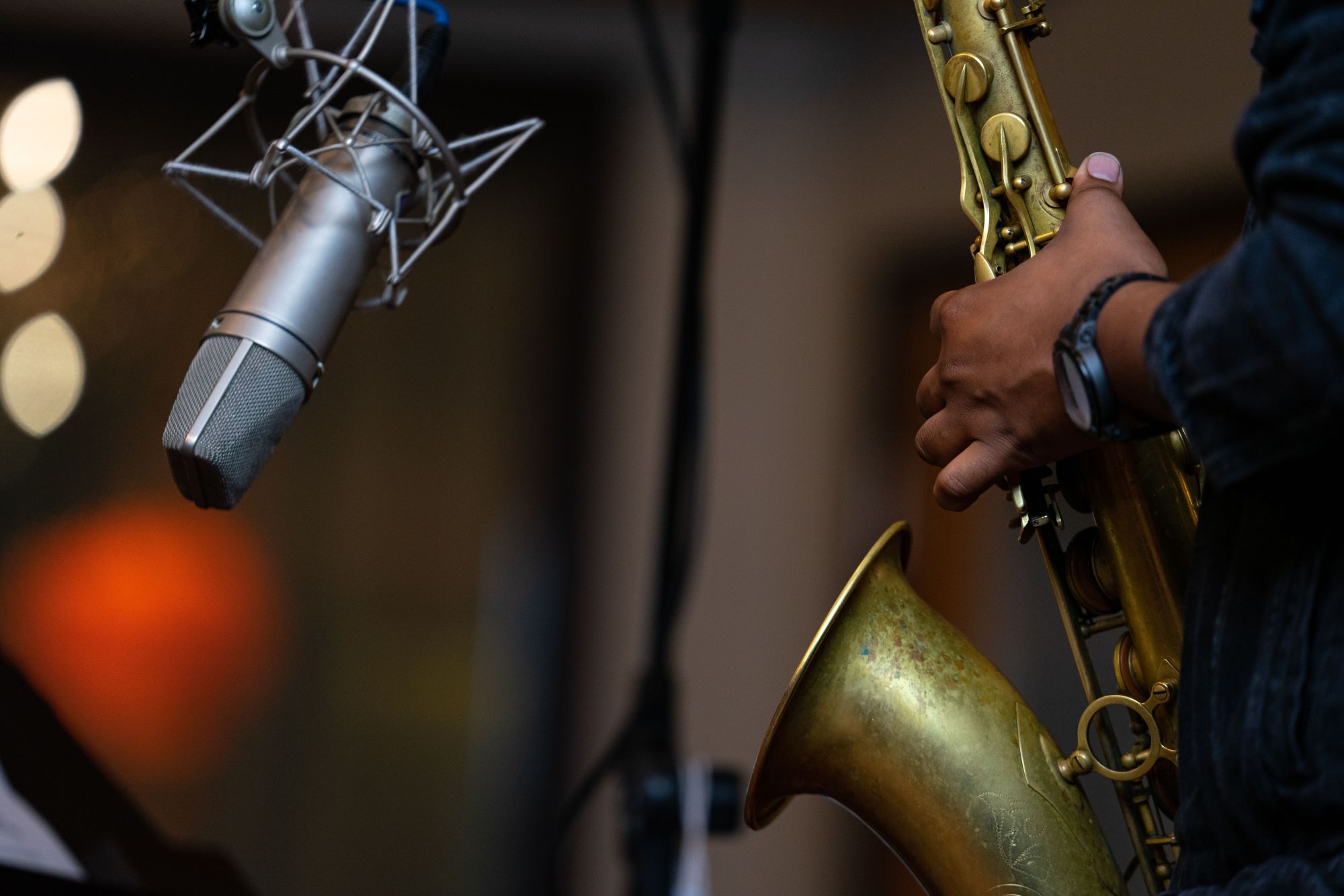 a saxophone and microphone closeup at a concert